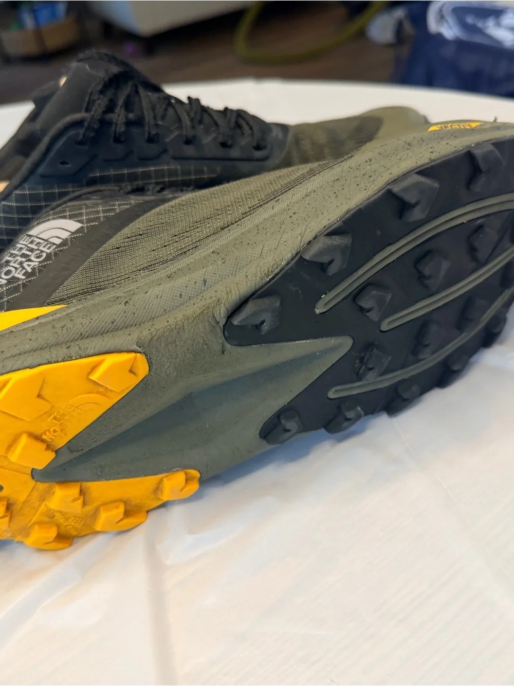 The North Face Men's Black and Olive Trail Shoes with Yellow and Red Accents